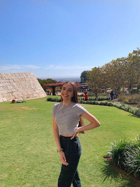 picture of me posing on a grassy hill at The J. Paul Getty Center in Los Angeles, CA. 