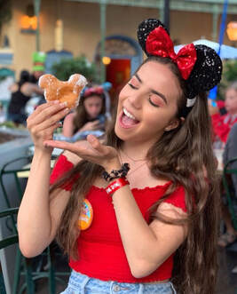 Picture of me at Disneyland posing with my beignet